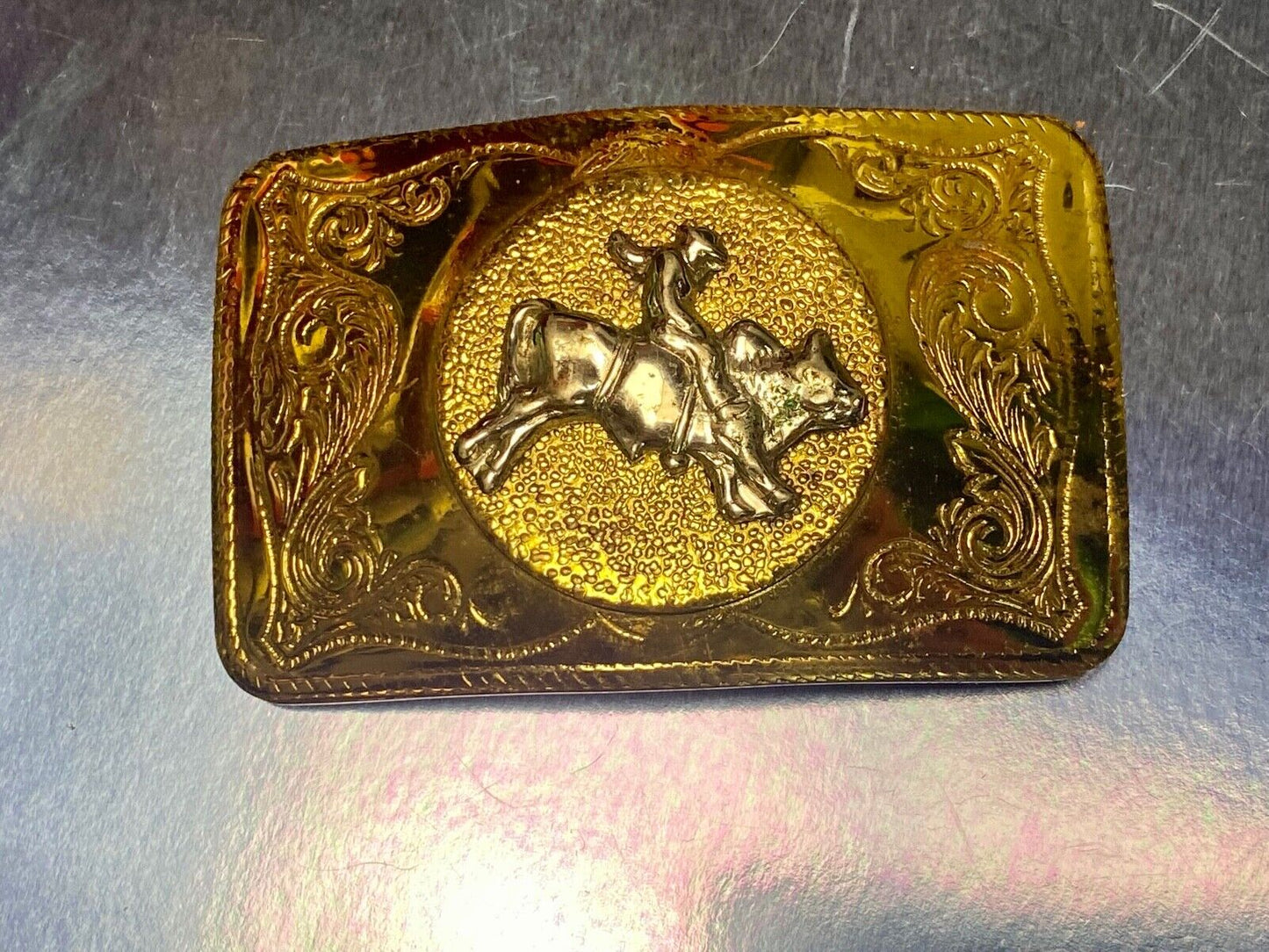 Beautiful ornate solid brass rodeo cowboy on rectangular western belt buckle