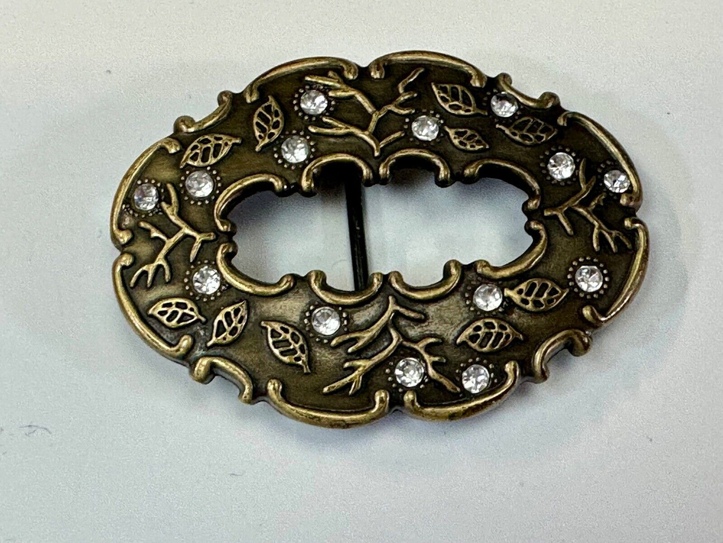3" wide brown rhinestone accented leaf pattern semi oval belt buckle