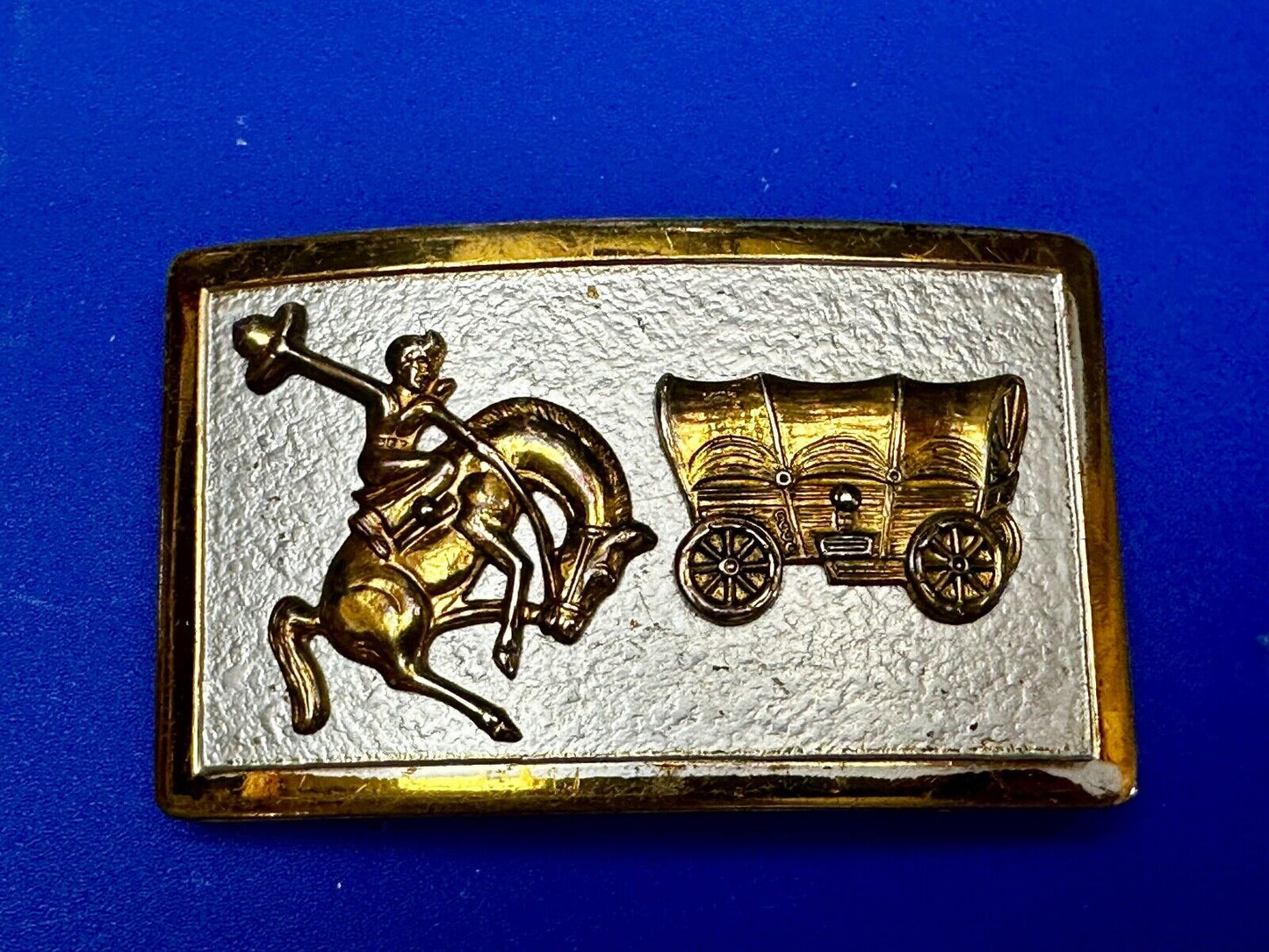 Vintage Cowboy Saddle Bronc western Covered wagon gold tone belt buckle