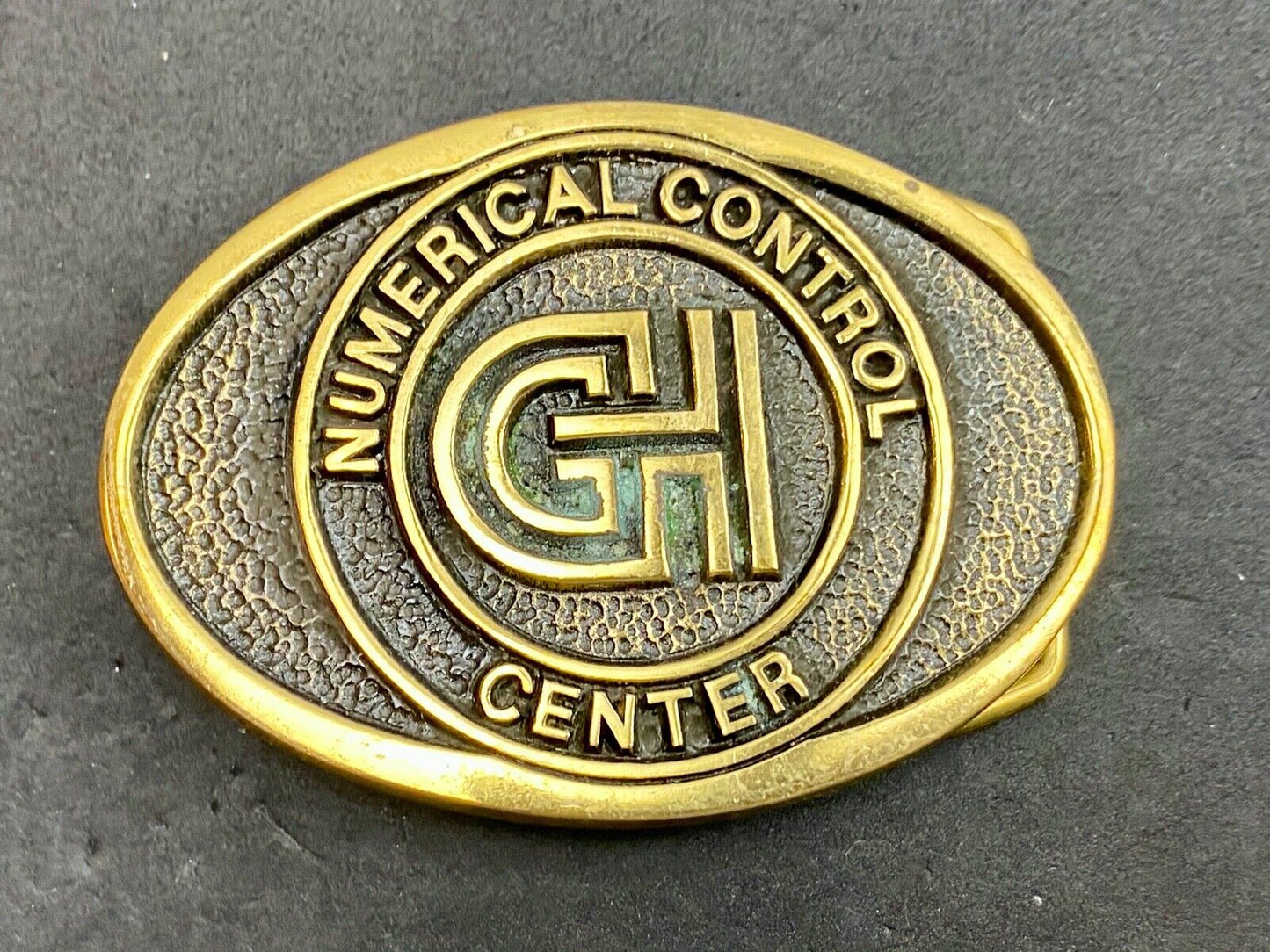 Vintage GH Numerical Control Center solid brass belt buckle by Blue Bayou