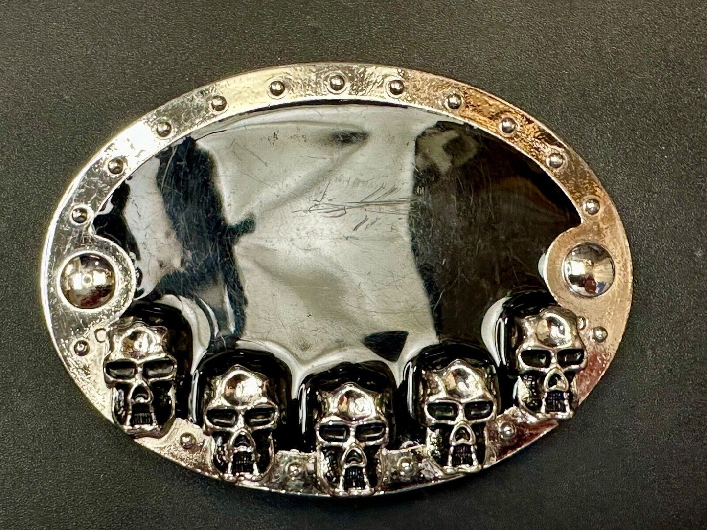 Black and silver Belt Buckle with multiple skulls on boarder