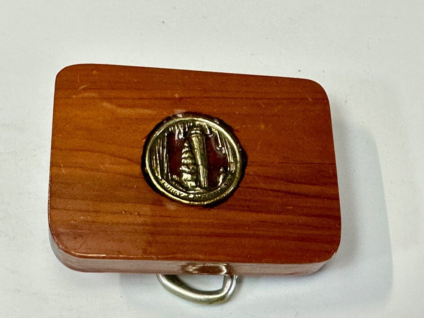 Artisan wood belt buckle with inlaid Luary Caverns cave token coin