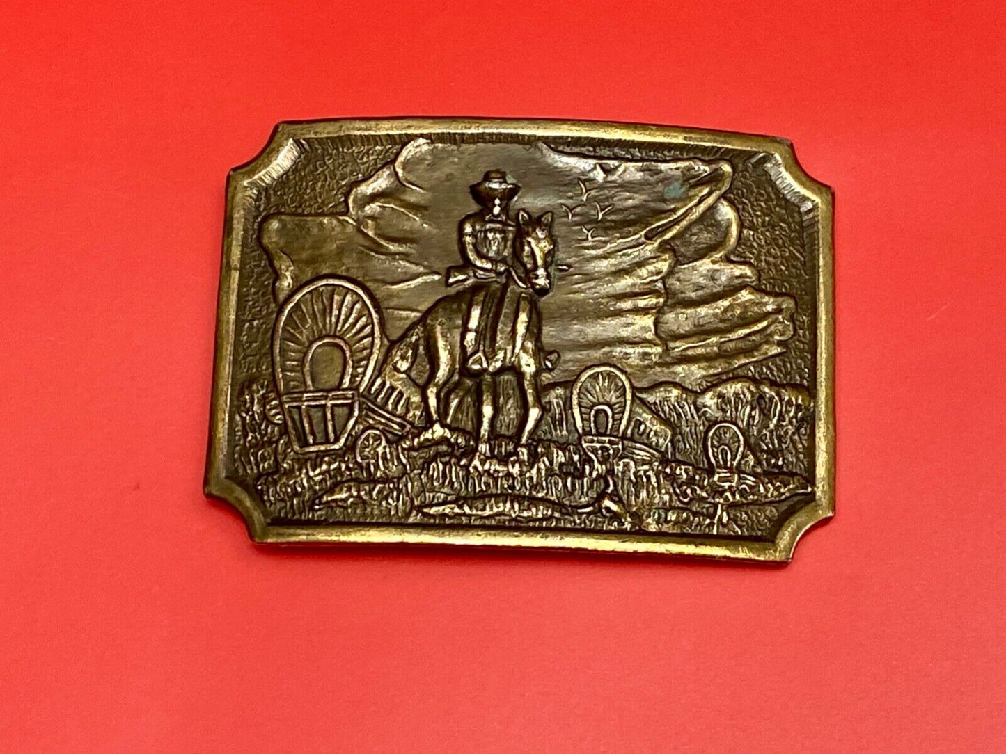 Tall in the Saddle - Covered Wagon Cowboy brass tone western belt buckle