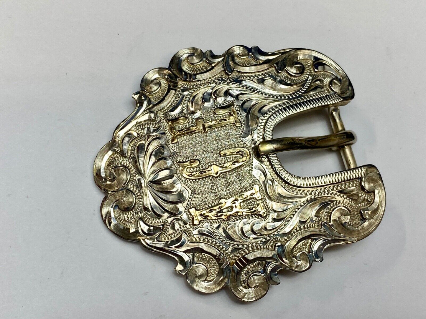 Vintage ACE Western cowboys flower swirl belt buckle design by DALE Chavez