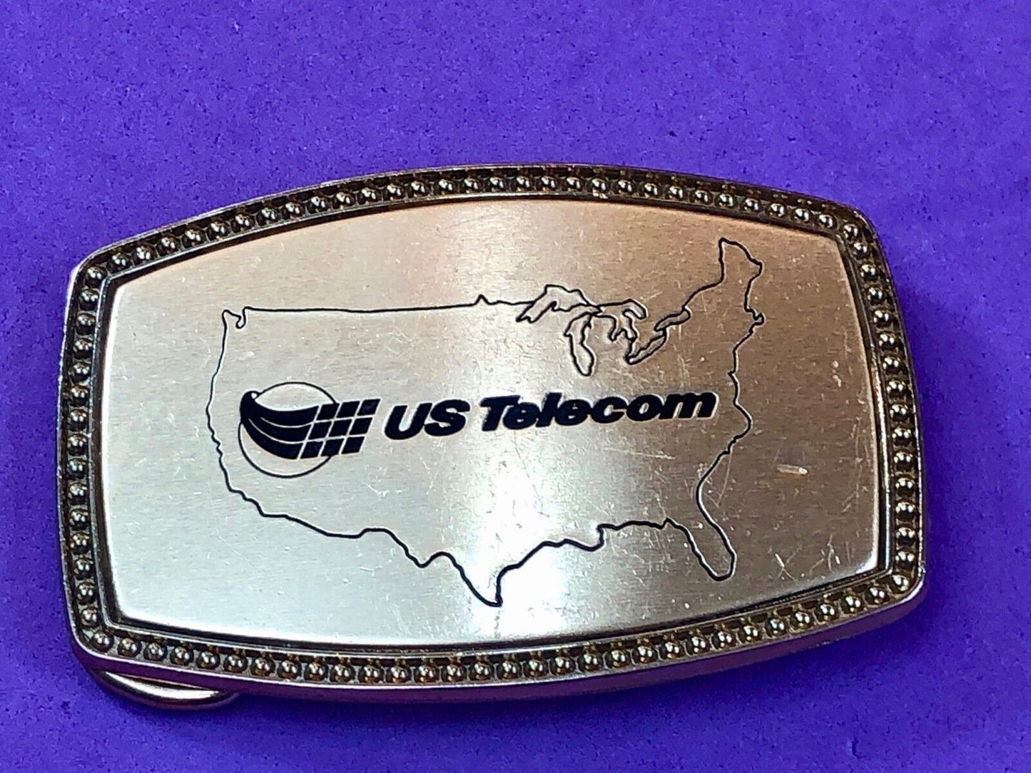 us telecom Telecommunications Industry Promotional belt buckle by Alumaune