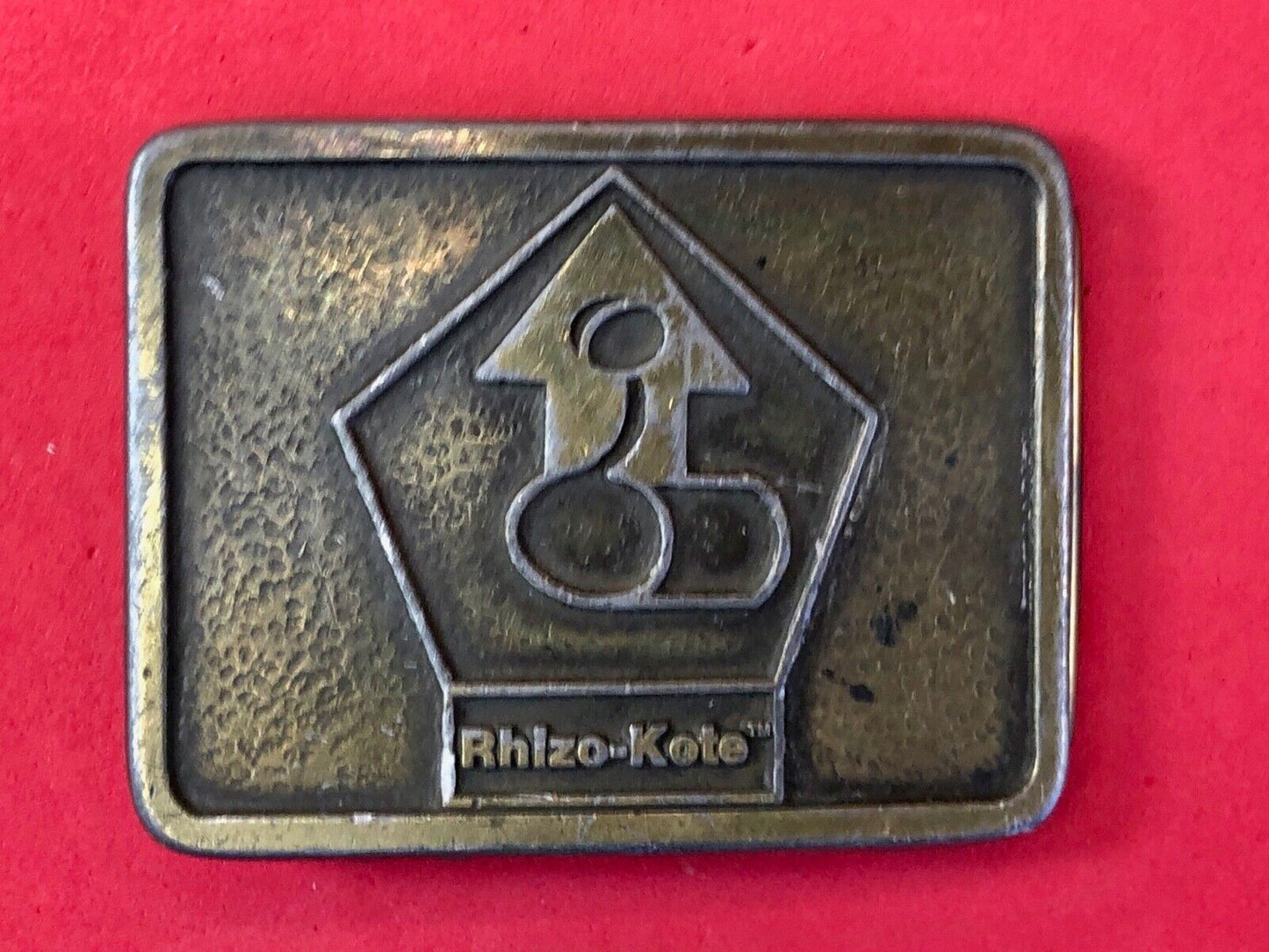 Vintage advertising Rhizo kote seal coating company belt buckle