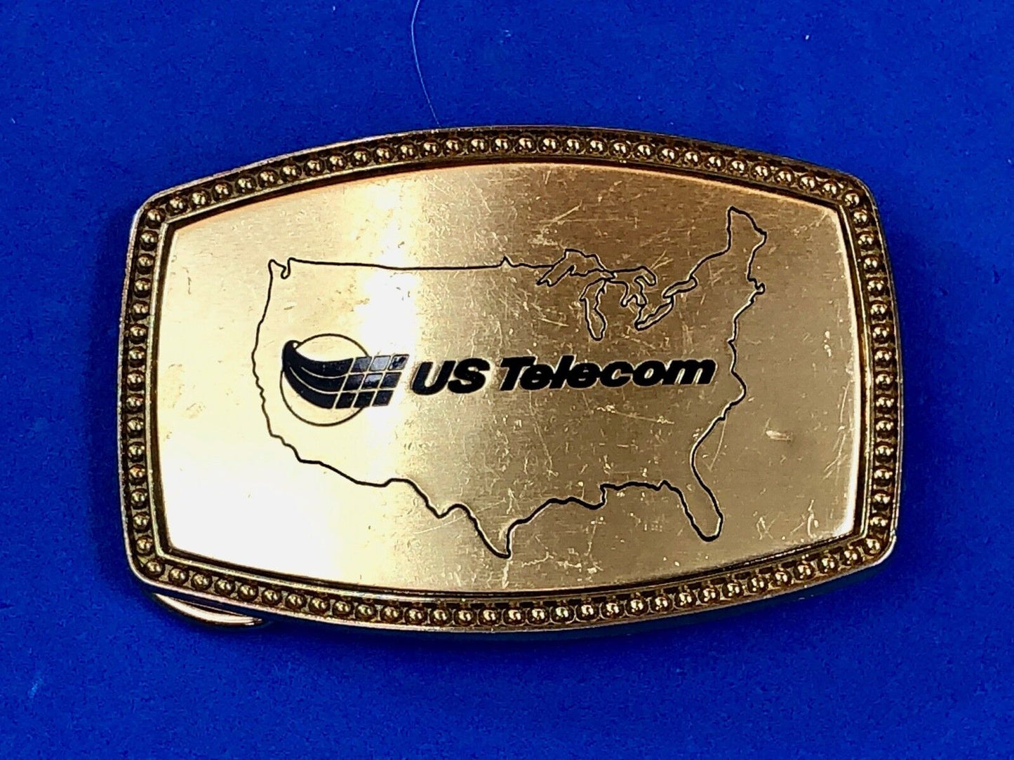 us telecom Telecommunications Industry Promotional belt buckle by Alumaune