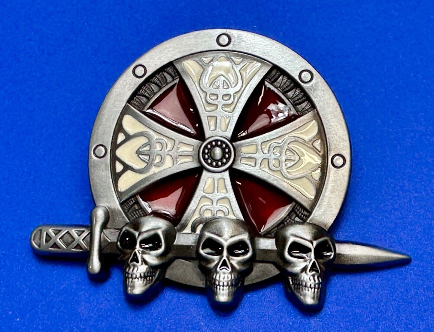 Three skulls with sword through heads on Iron Cross round NOS belt buckle