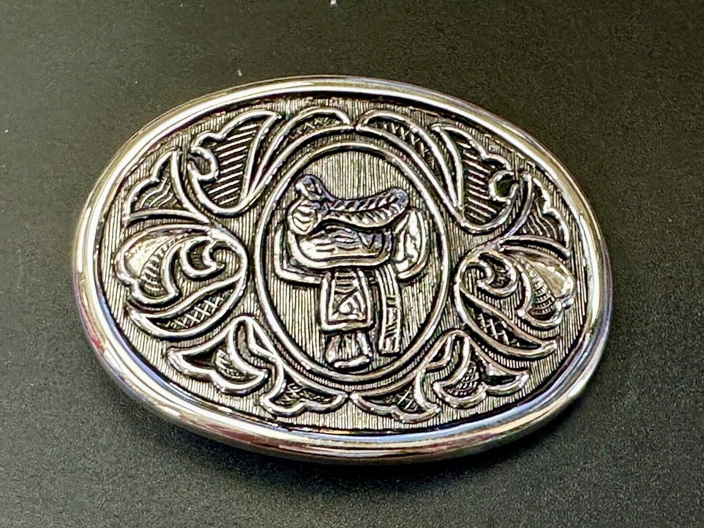 Vintage Cowboy's Horse Saddle ornate flower swirl oval belt buckle by Avon