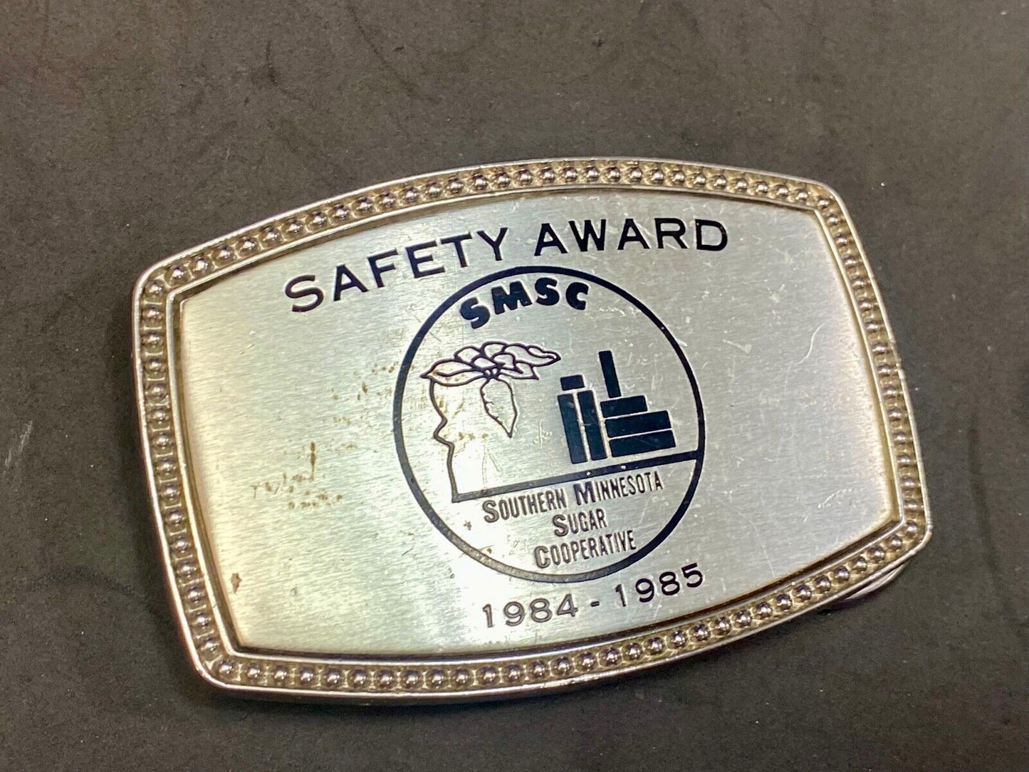 1985 - Smsc Southern Mn Sugar Cooperative Safety Award Belt Buckle By Alumaline