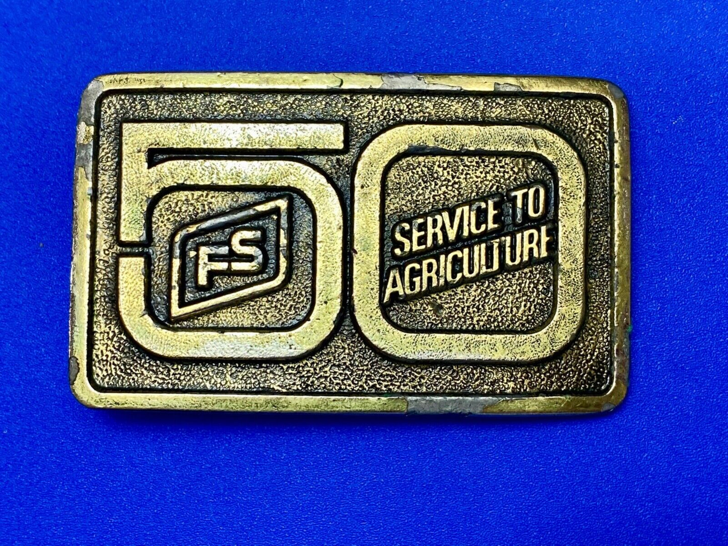50 years, Farm Service to Agriculture belt buckle by Wyoming Studio Art works