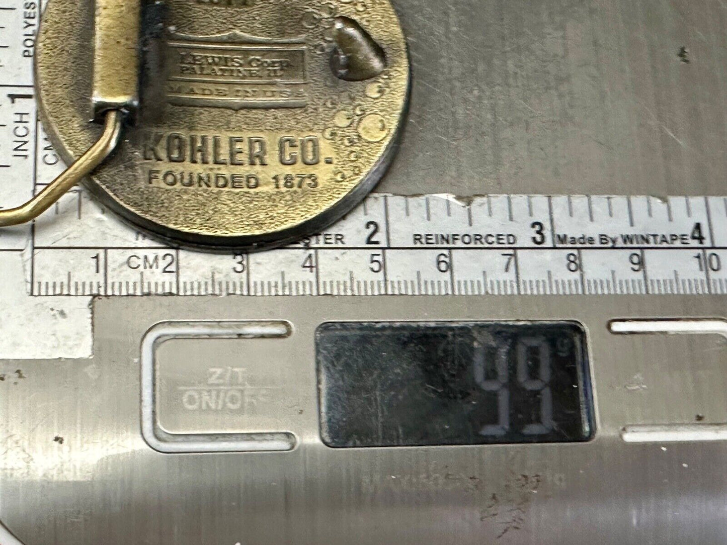 The Bold Look of Kohler Vintage 1977 Lewis round Limited Edition belt buckle