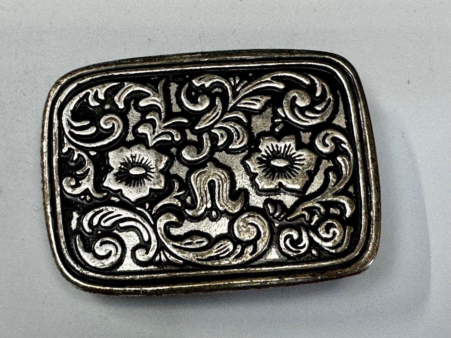 Vintage black and silver tone western flower floral theme cowboys belt buckle