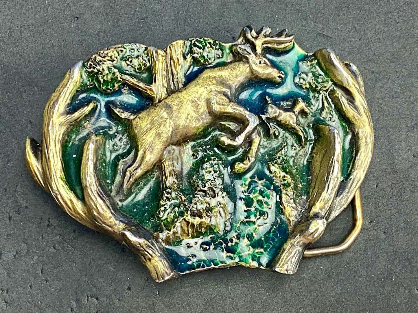 VINTAGE 1982 JUMPING DEER THROUGH ANTLERS - The Great American belt buckle Co.