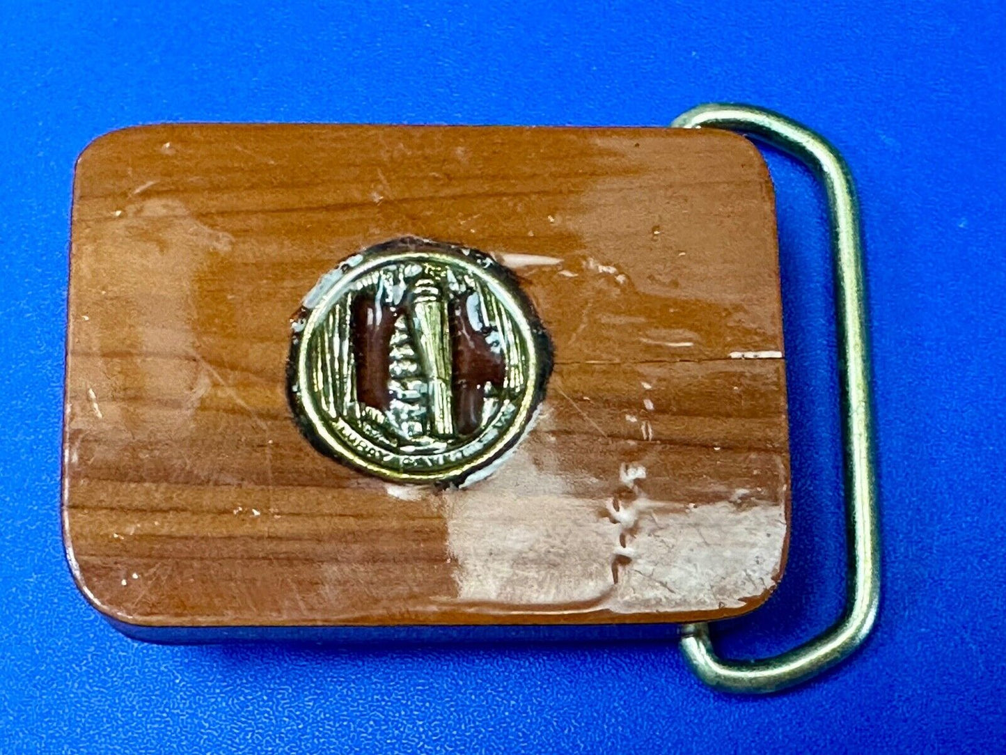 Artisan wood belt buckle with inlaid Luary Caverns cave token coin