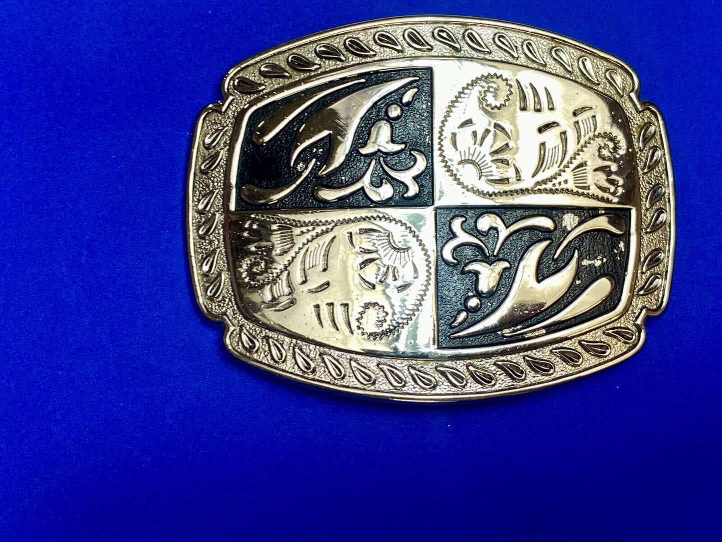 black and silver color western flower swirl outlined cowboy's belt buckle