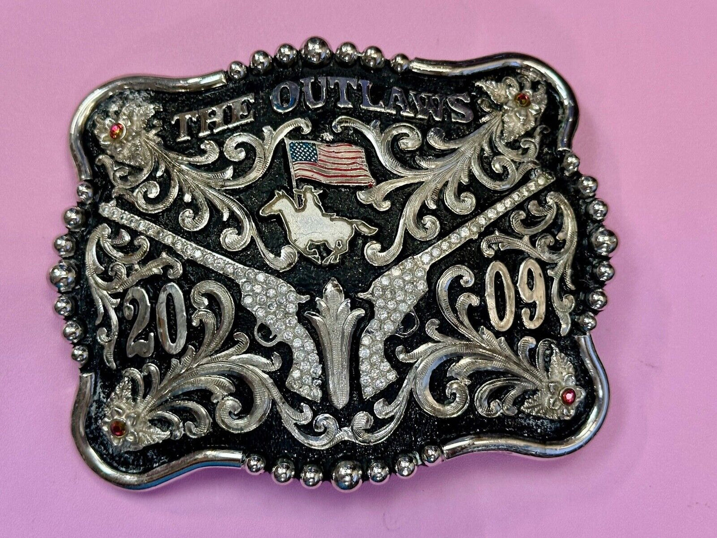 The Outlaws Rodeo Cowboy Trophy 2009 Flag Belt Buckle - Crossroads bucklesTexas