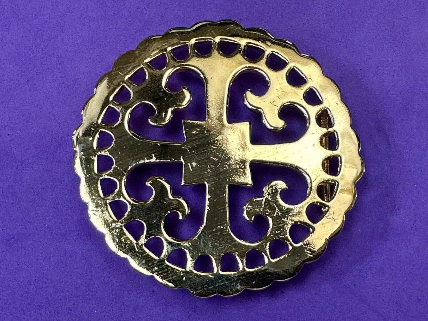 vintage Celtic pattern round cutout belt buckle by designer Ann Lansing