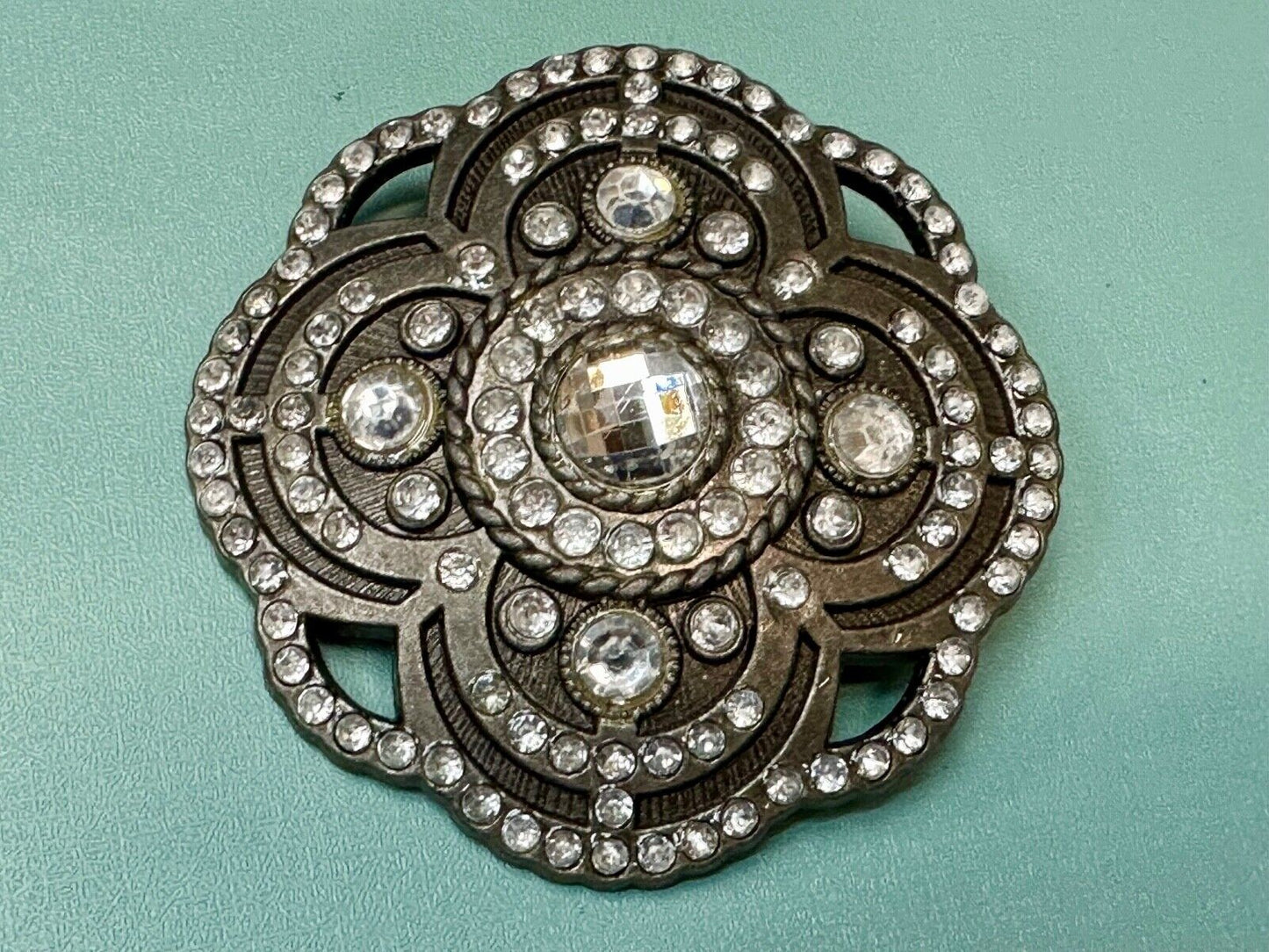 Beautiful Rhinestone accented see through flower shaped cutout belt buckle