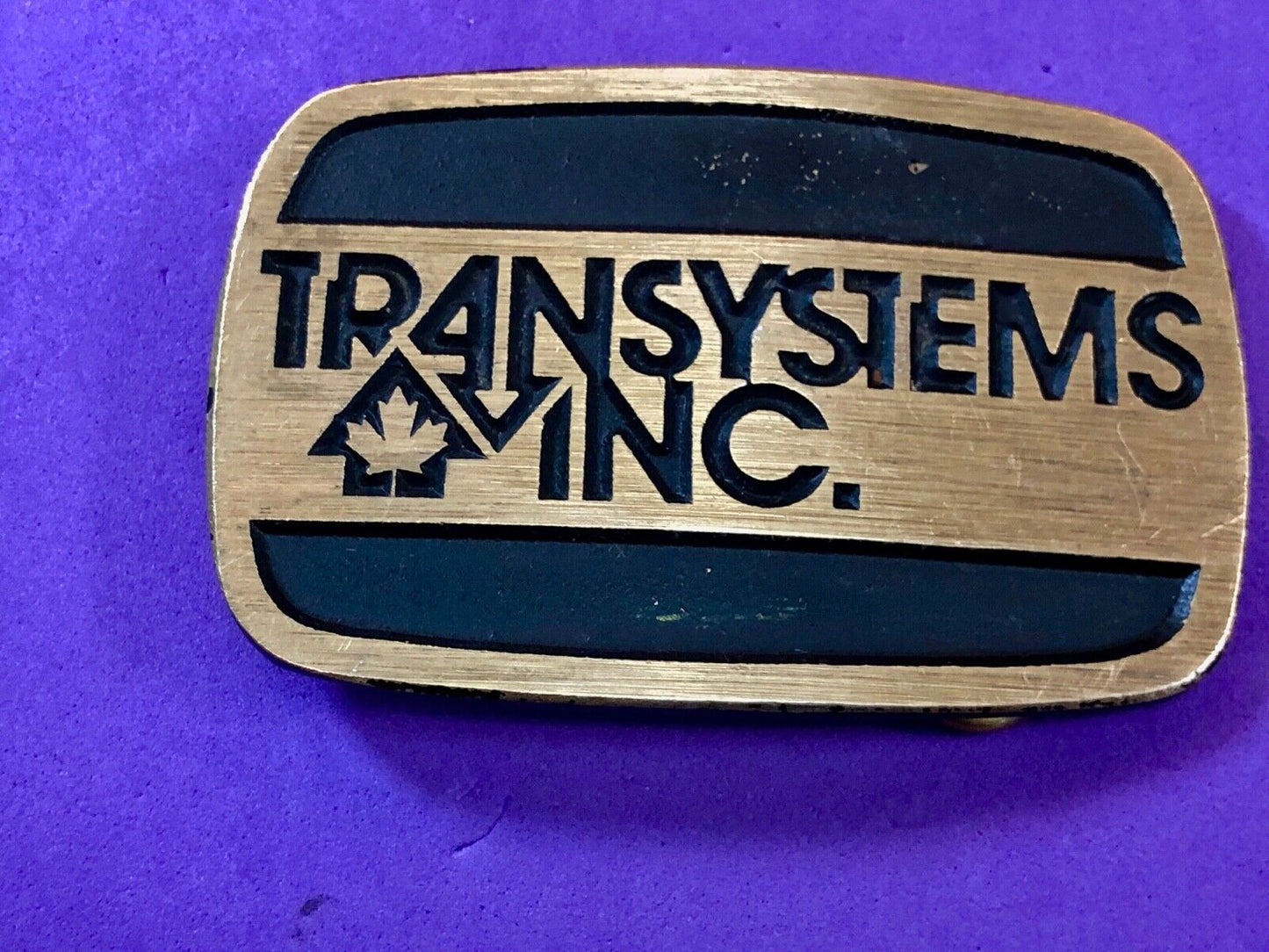transystems inc Canada Promo belt buckle -a Construction engineering company