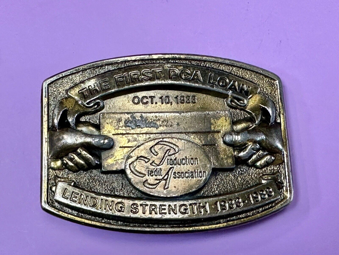 The First PCA loan Production Credit - Vintage The Great American Belt Buckle Co
