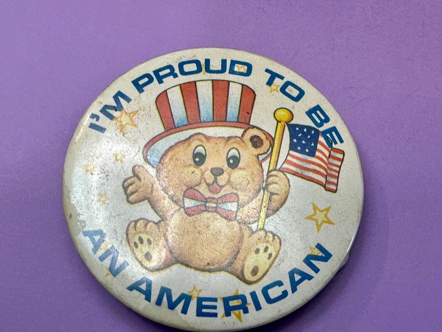 Teddy Bear Holding Flag, Proud To Be An American Artisan Button into Belt Buckle