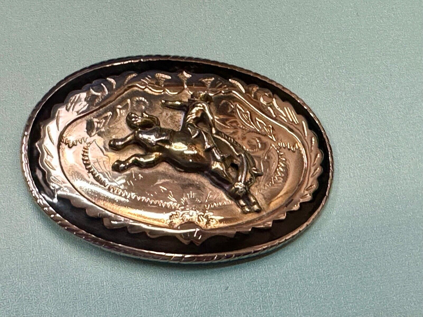 Beautiful Cowboy Saddle Bronc western black silver gold color belt buckle
