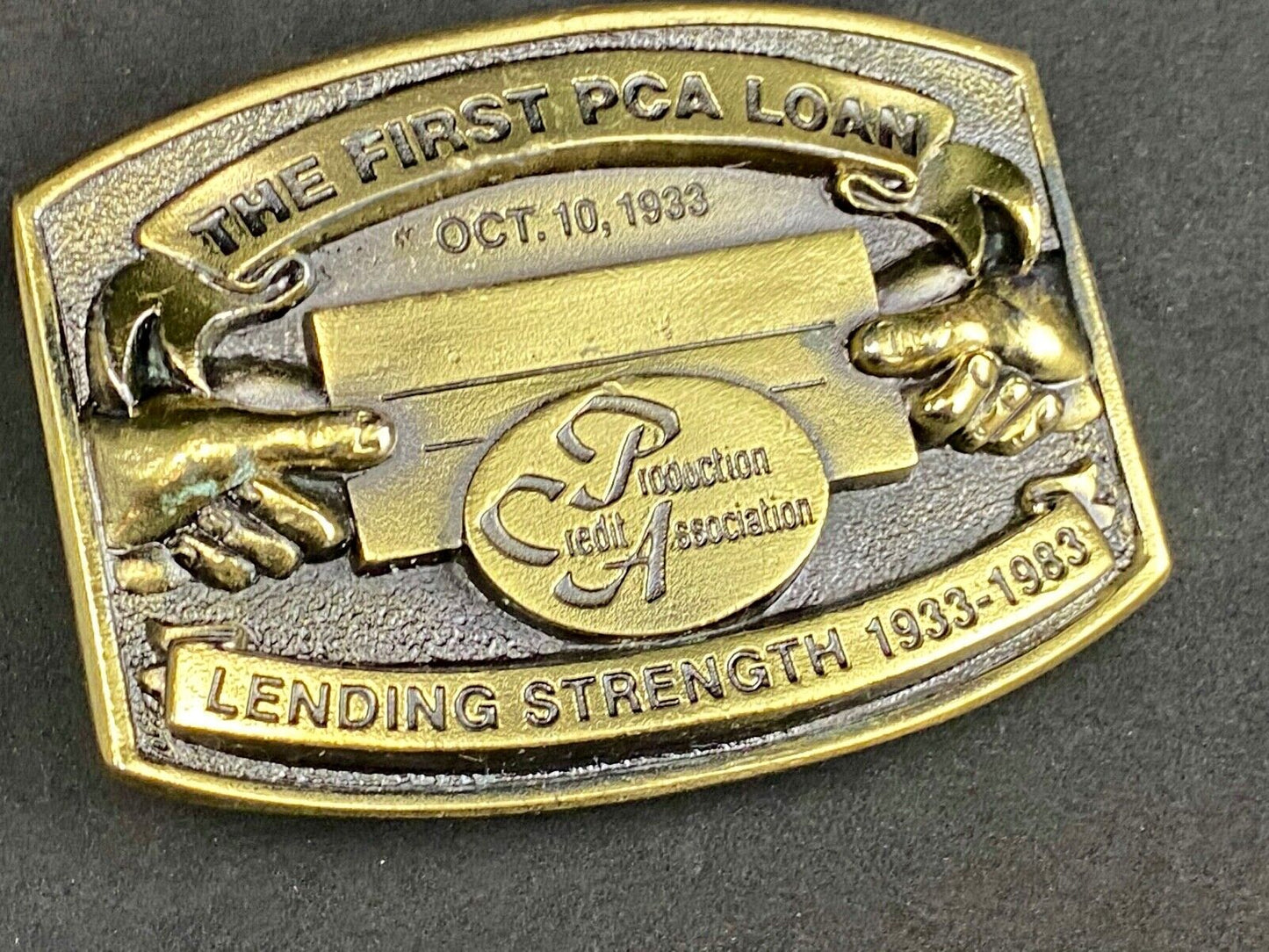 The First PCA loan Production Credit Assn. The Great American Belt Buckle Co