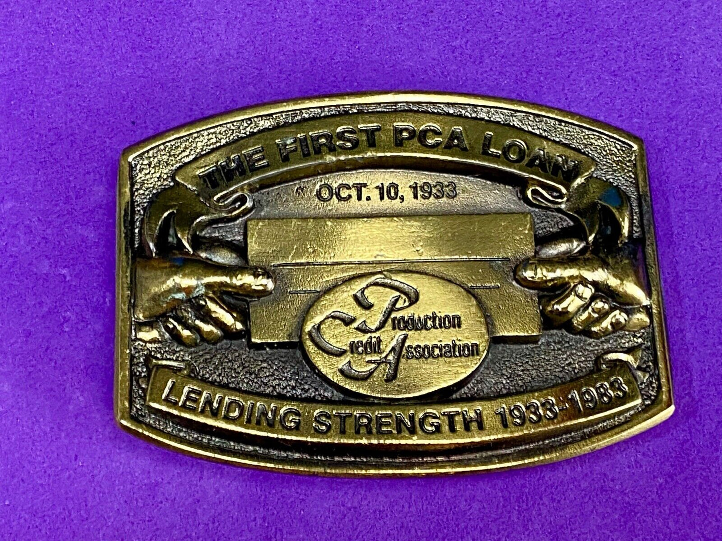 The First PCA loan Production Credit Assn. The Great American Belt Buckle Co