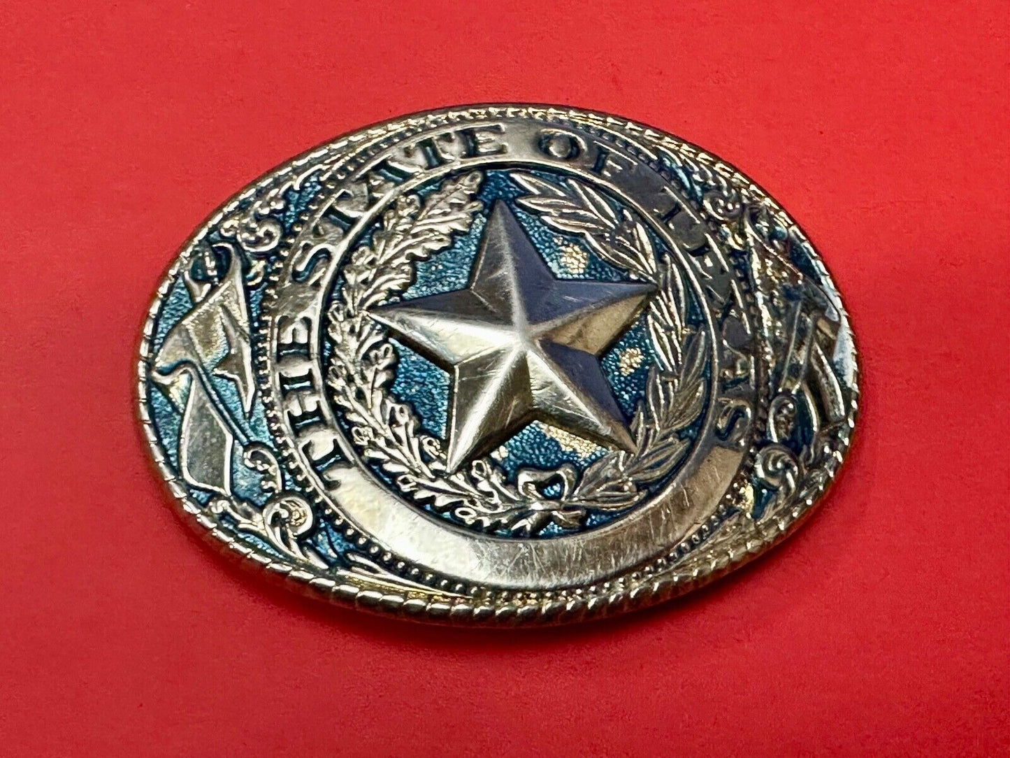 The Great State of Texas - gold color star belt buckle with blue colored accents