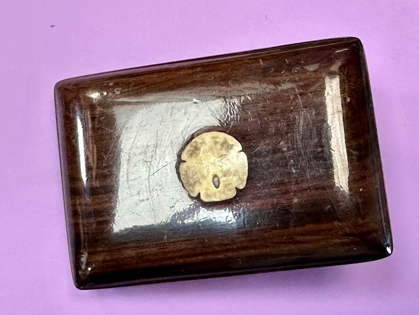 Artisan wood belt buckle with small inlaid sand dollar sea shell