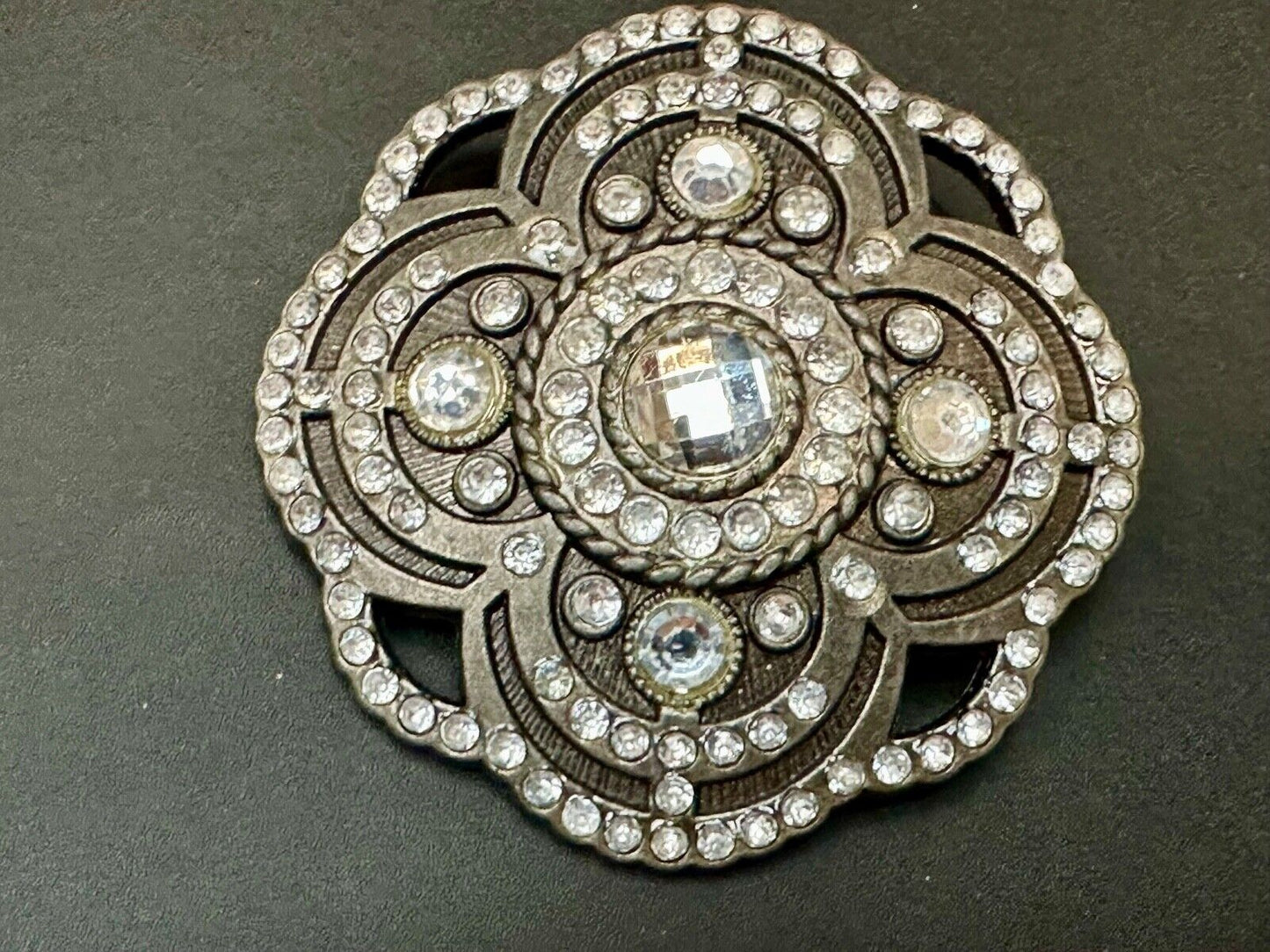 Beautiful Rhinestone accented see through flower shaped cutout belt buckle