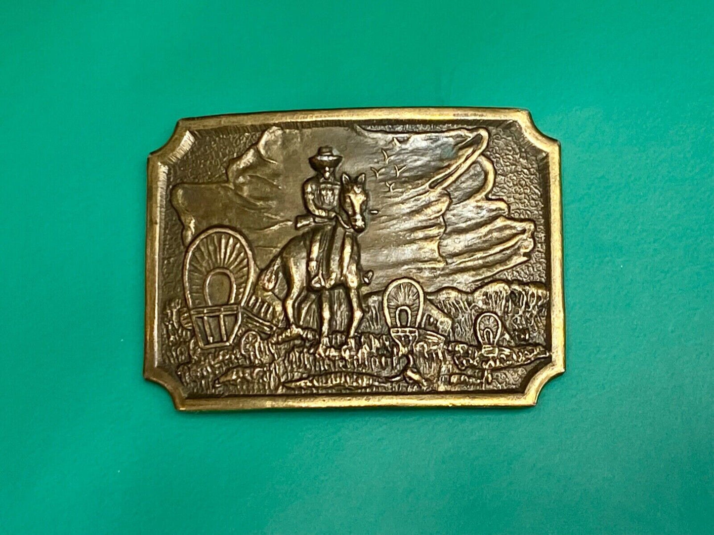 Tall in the Saddle - Covered Wagon Cowboy brass tone western belt buckle
