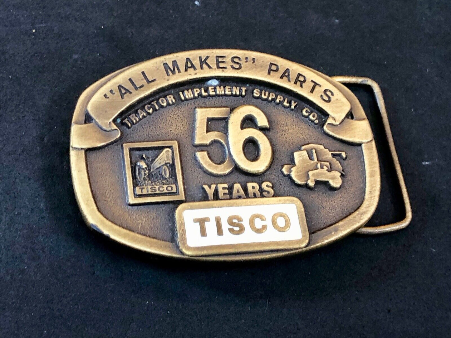 TISCO - 56 years tractor farming parts supply store advertising belt buckle