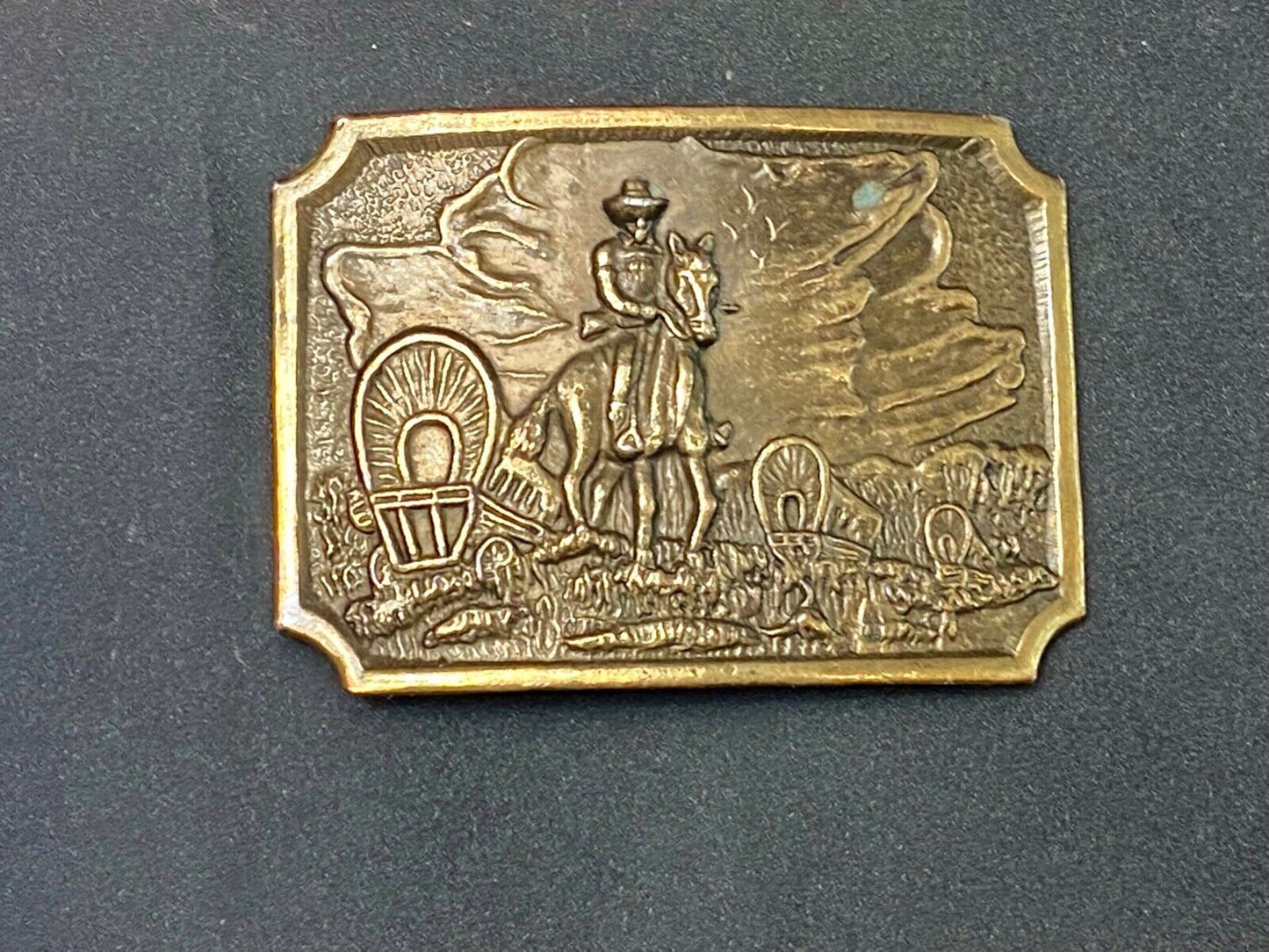 Tall in the Saddle - Covered Wagon Cowboy brass tone western belt buckle