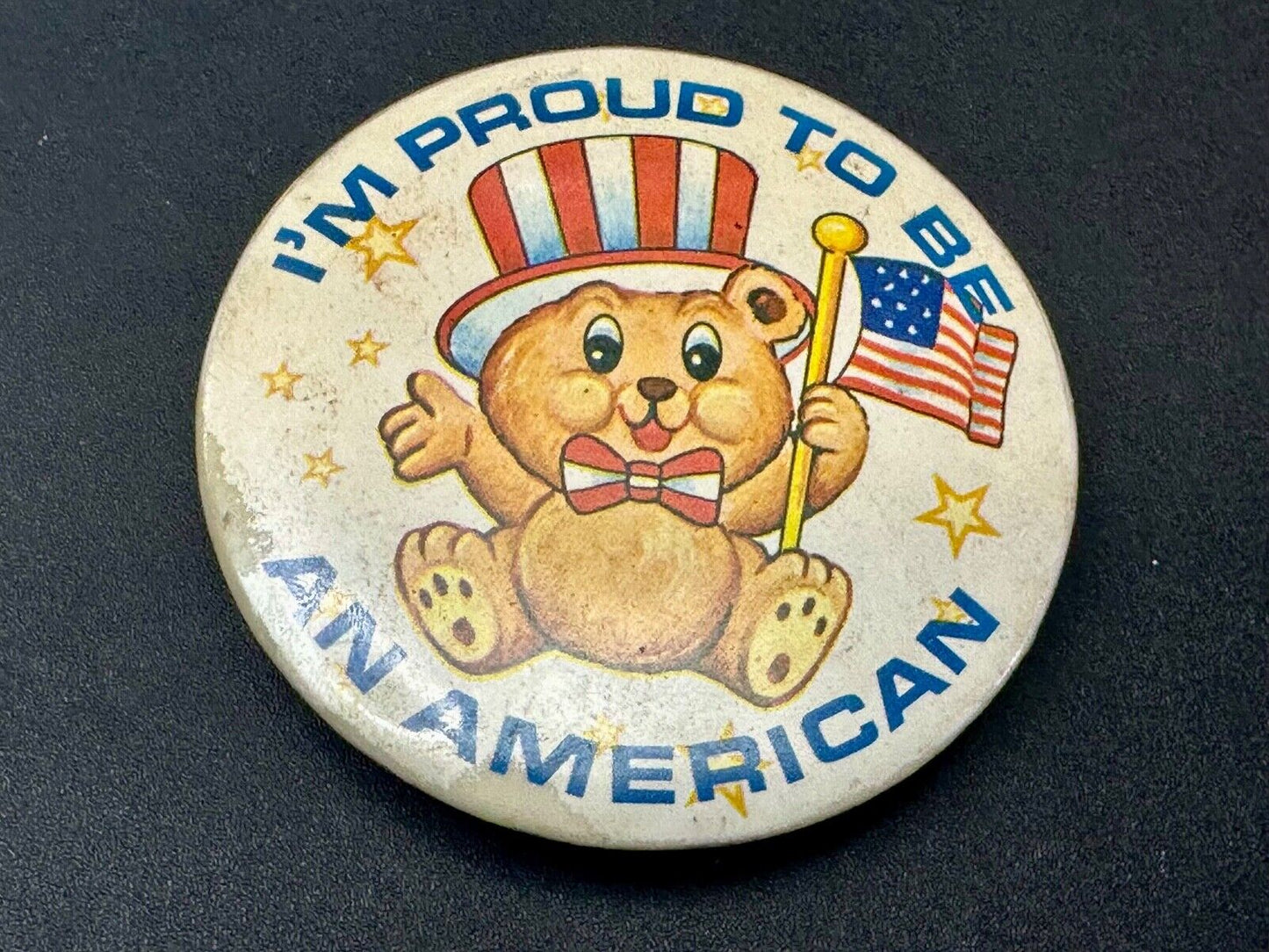 Teddy Bear Holding Flag, Proud To Be An American Artisan Button into Belt Buckle