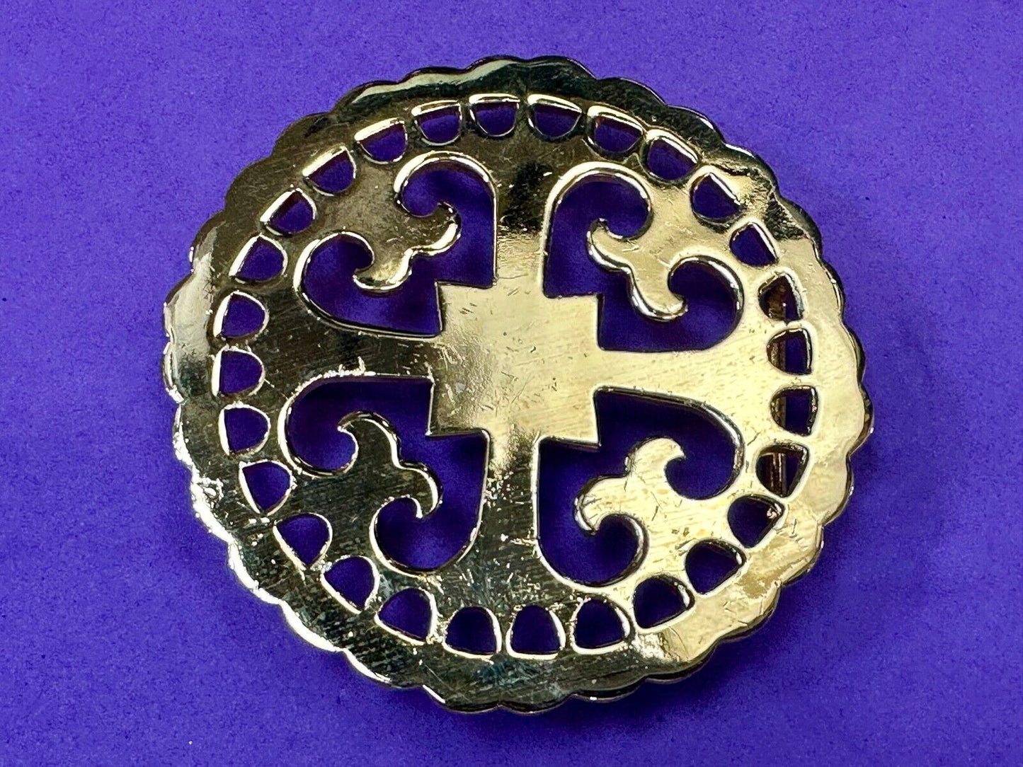 vintage Celtic pattern round cutout belt buckle by designer Ann Lansing
