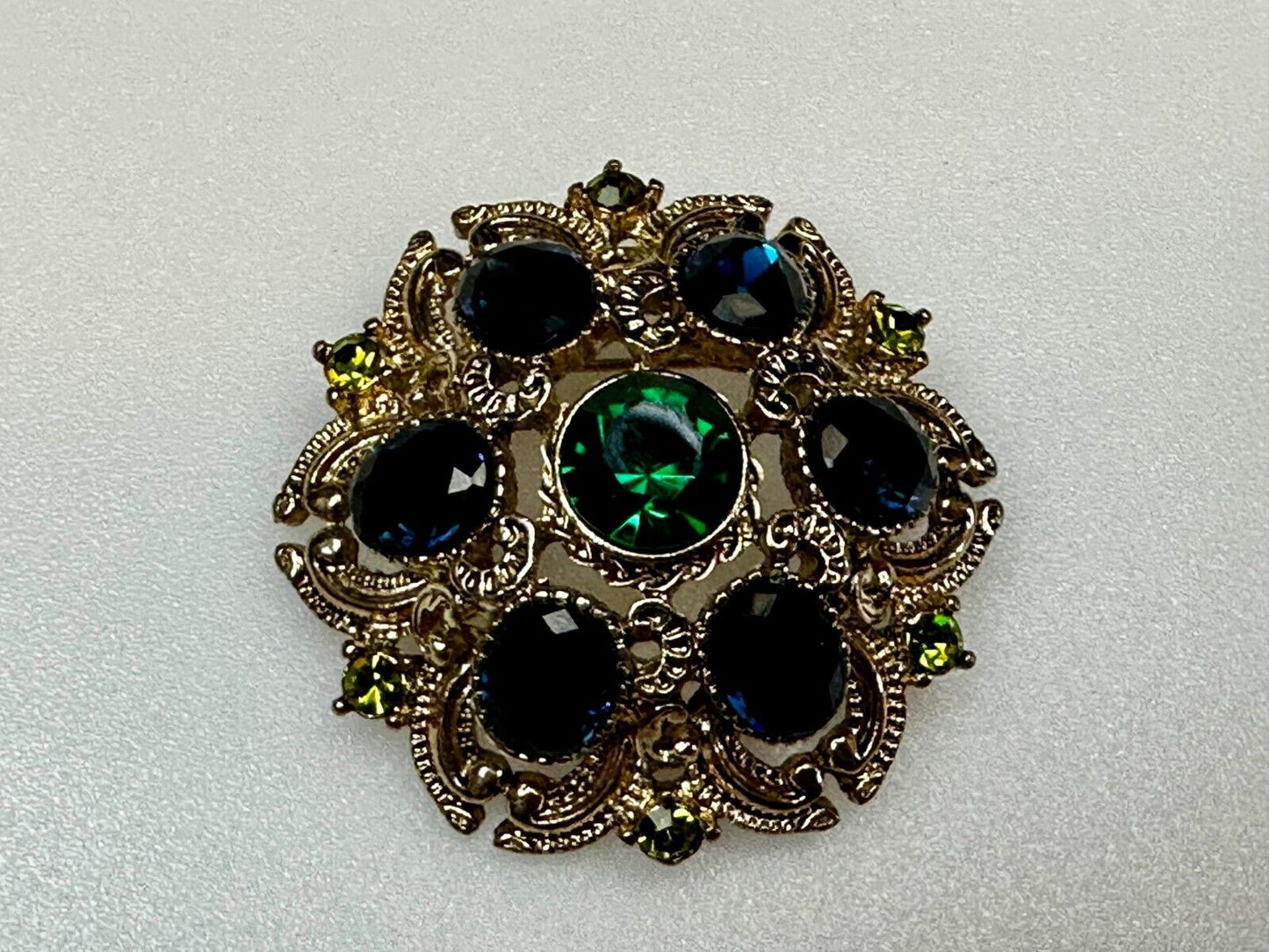 Beautiful Round Flower Shaped Blue Green Rhinestone Brooch Pin Signed by SQUIRE
