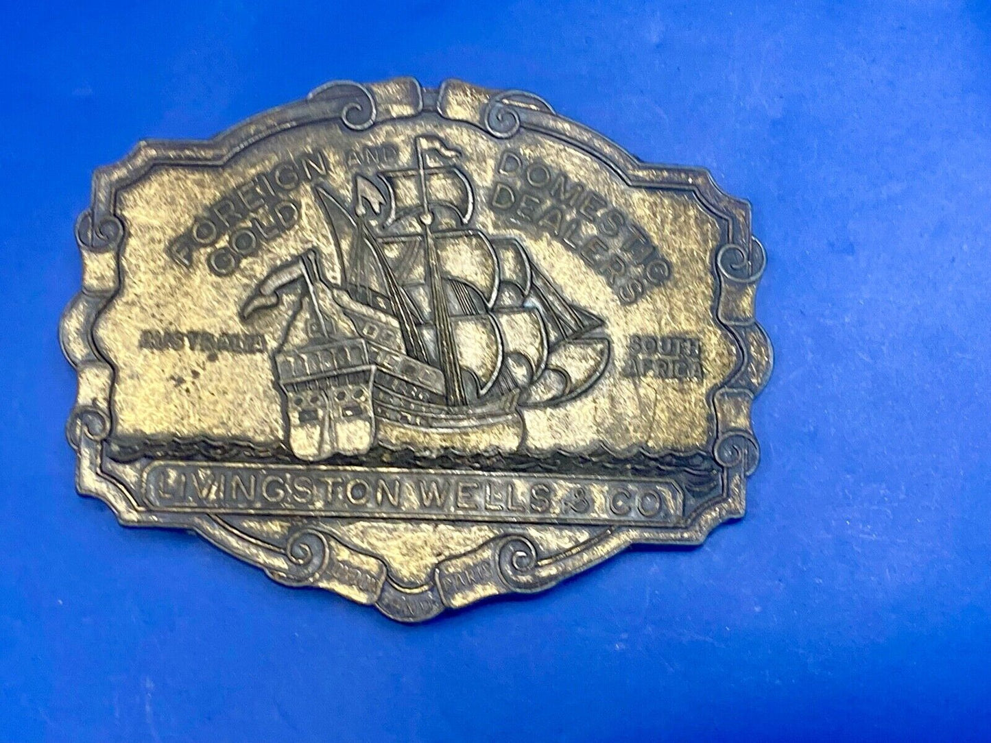 VINTAGE ANTIQUE METAL BELT BUCKLE- Livingston Wells & Co Sailboat Ship