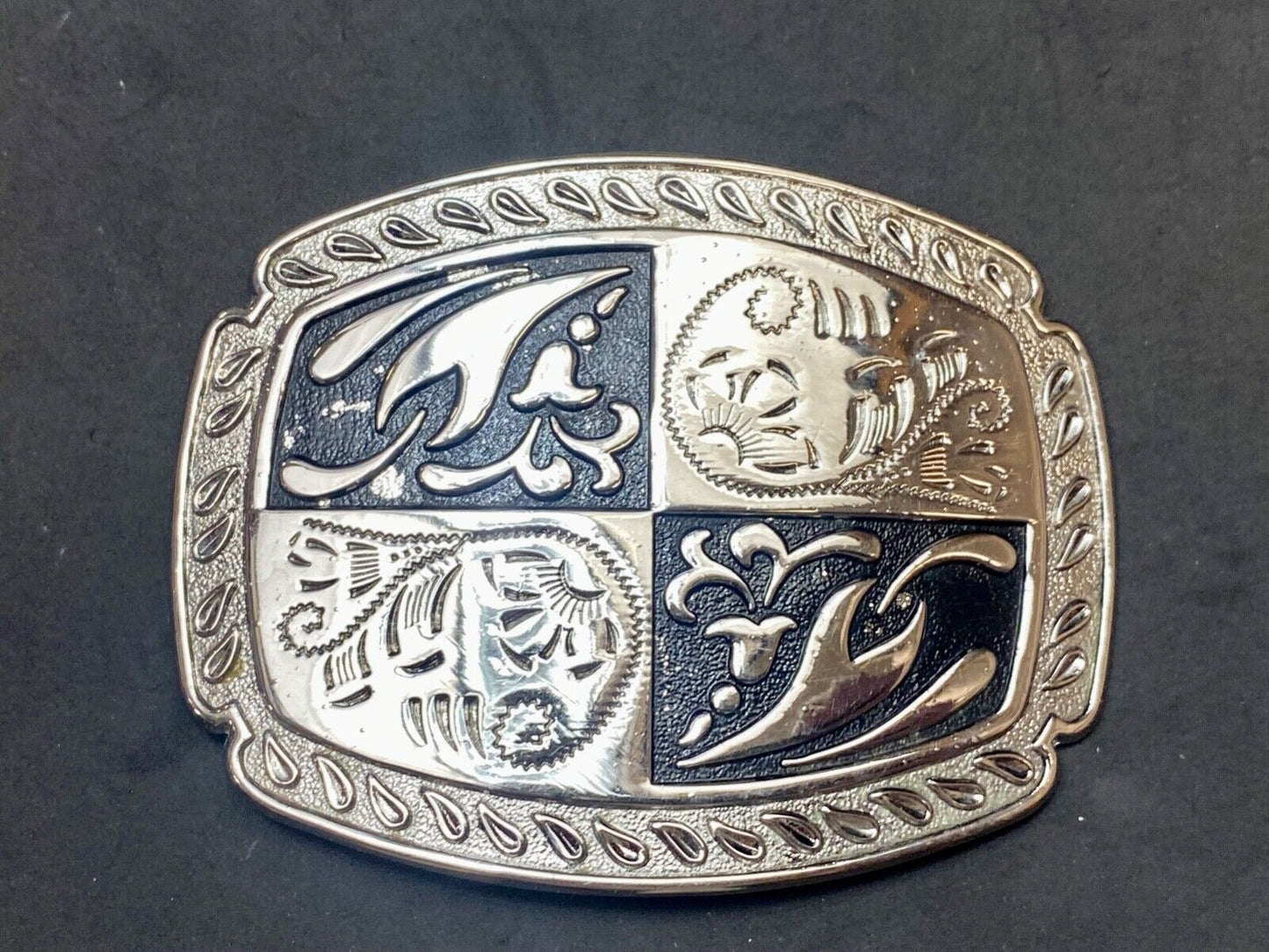 black and silver color western flower swirl outlined cowboy's belt buckle