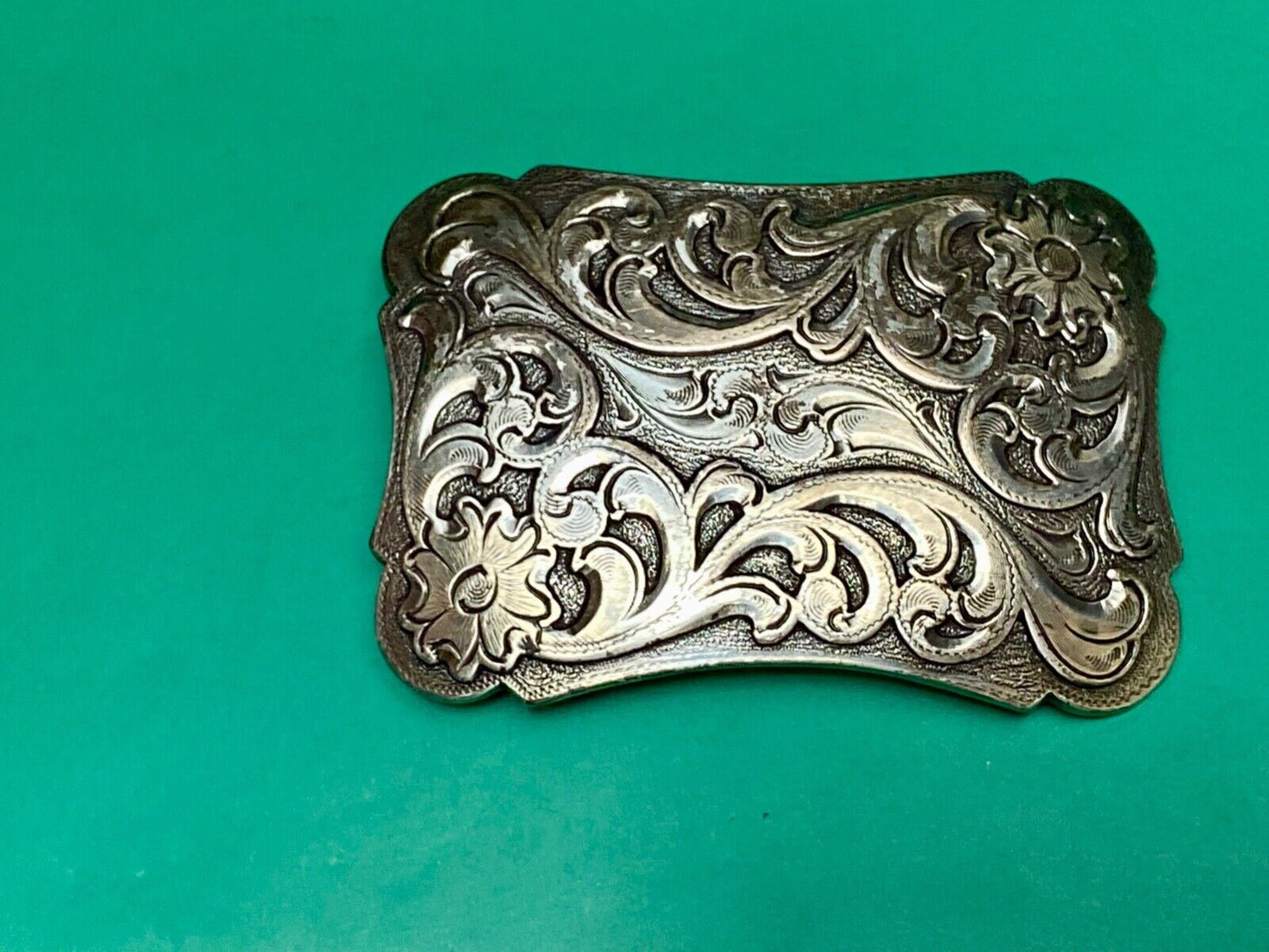 Thick flower swirl silver color western belt buckle