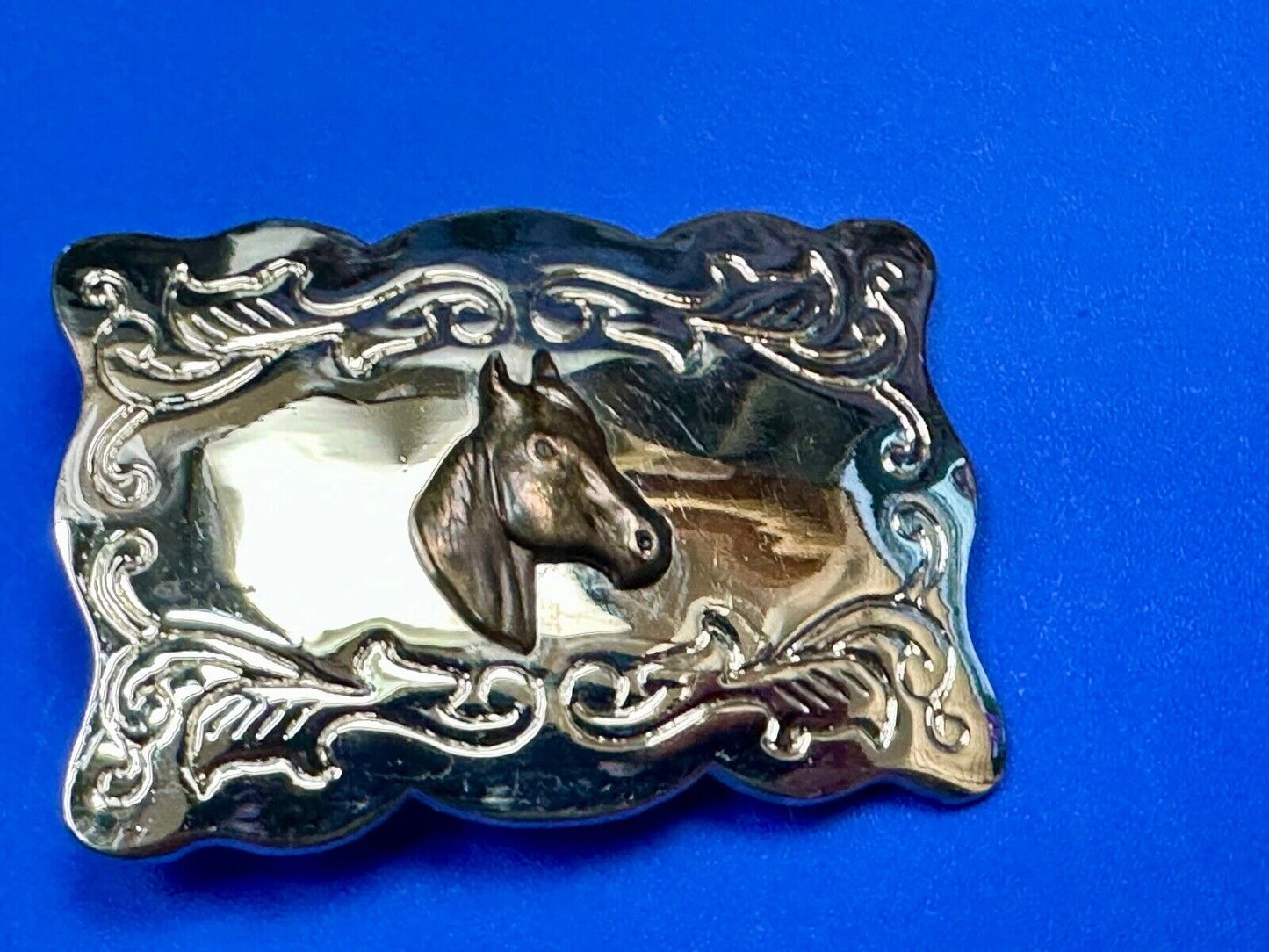 Vintage horse head centered on western rectangular two tone belt buckle