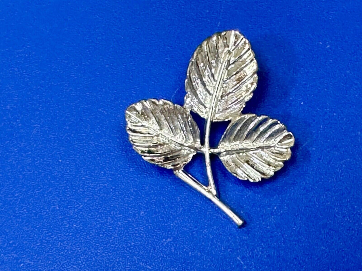 Three Leaf cutout Sarah Coventry signed silver tone brooch pin