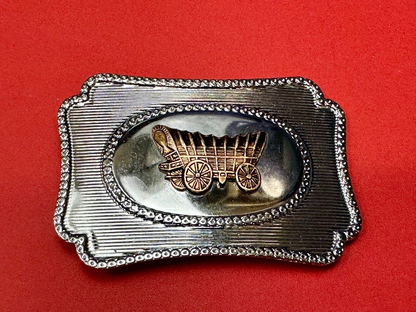 Vintage covered wagon western horse drawn transportation belt buckle