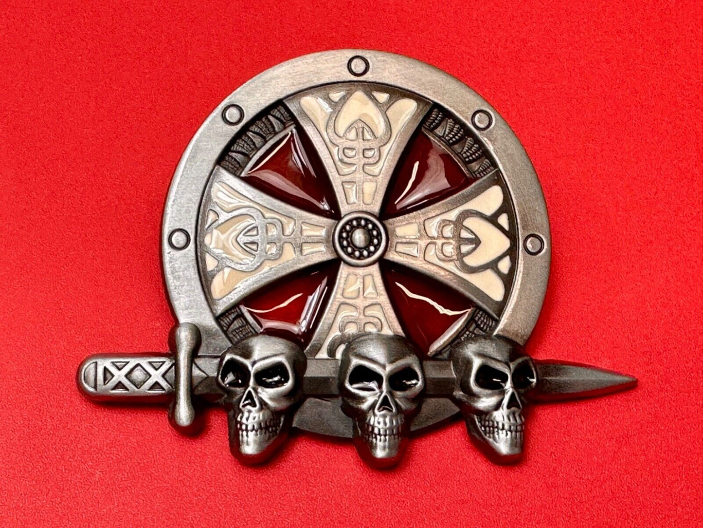 Three skulls with sword through heads on Iron Cross round NOS belt buckle