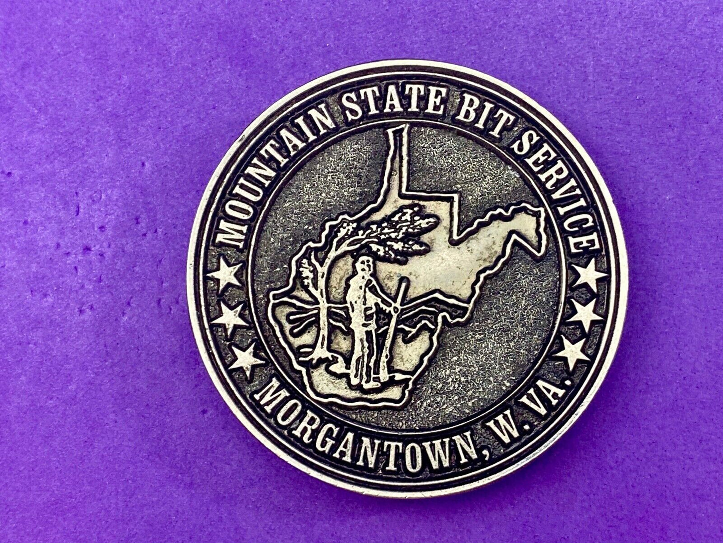 Vintage Mountain State Bit Services Morgantown W.V. round belt buckle by Lewis