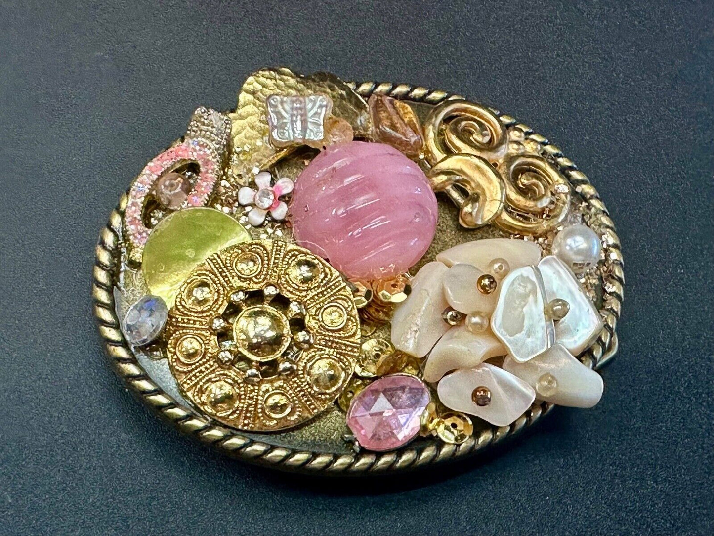 Artisan Abstract flowers made of mixed material on gold tone oval belt buckle