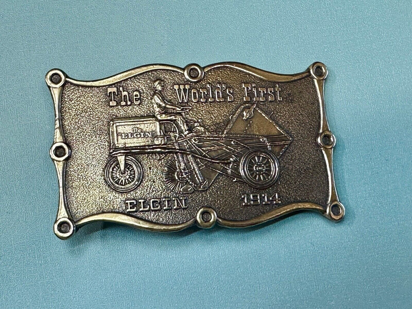 The Elgin, The worlds first tree sweeper commemorative belt buckle by Lewis