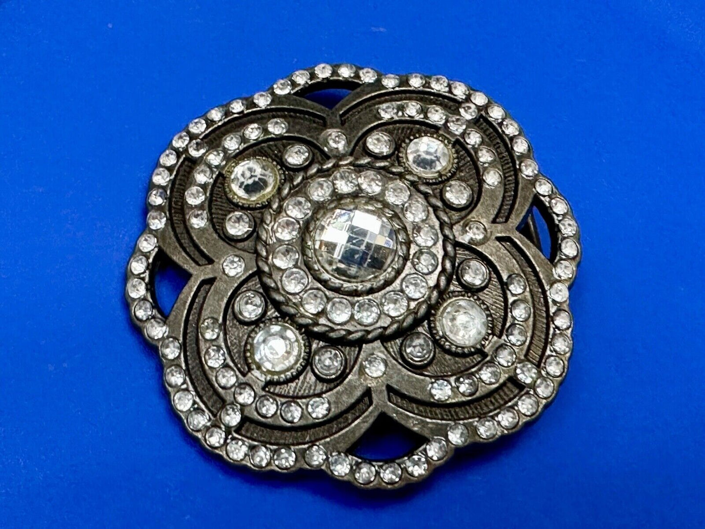 Beautiful Rhinestone accented see through flower shaped cutout belt buckle