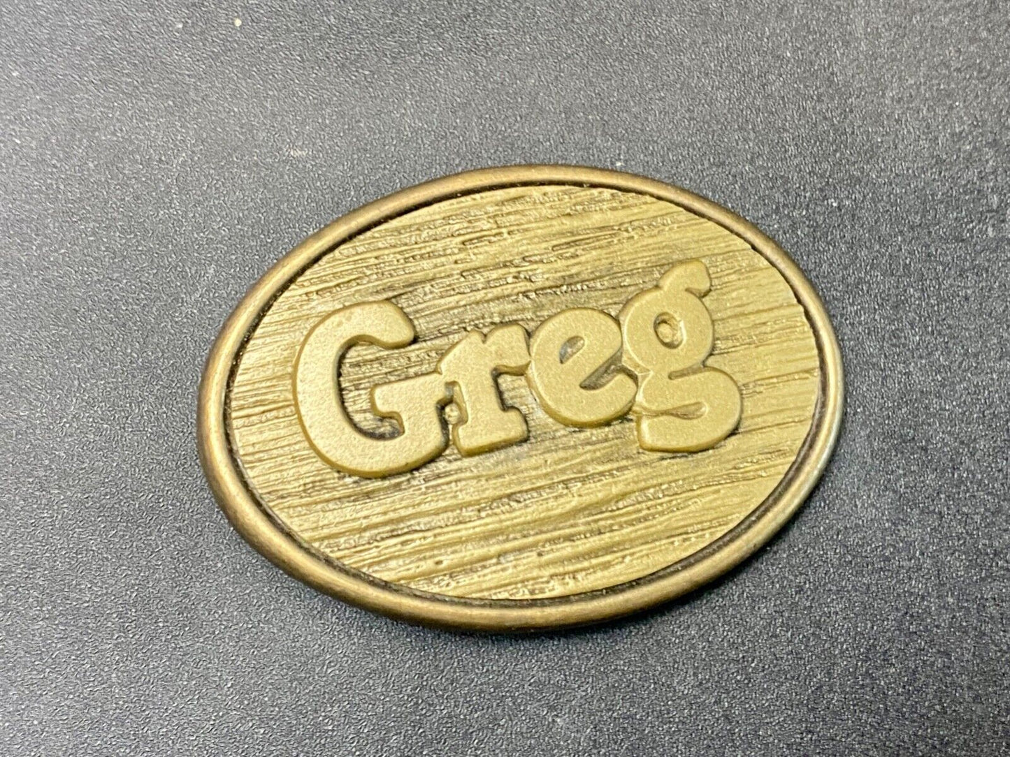 Vintage GREG name metal wood grain western Belt Buckle By Oden - Made In USA